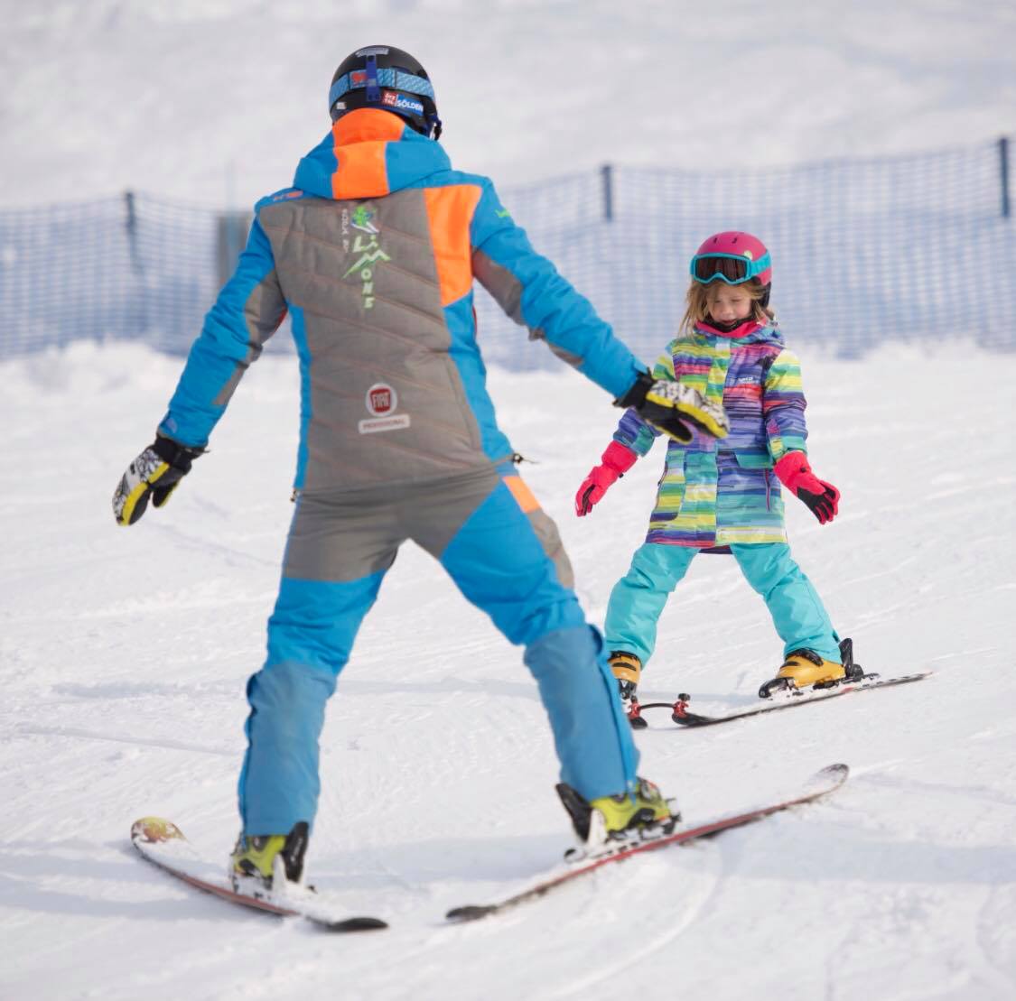 Ski instructor with a kid in Limone during one of the Kids Ski lessons for Beginners. 