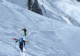 Participants climbing the mountain in fresh snow in Limone during one of the private off piste skiing lessons.