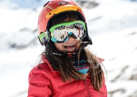 A little girl has a lot of fun during her kids ski lesson with Prosneige Tignes. 