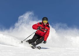 An advanced skier is improving his skiing ability during private ski lessons for adults with Swiss Ski School St. Moritz.