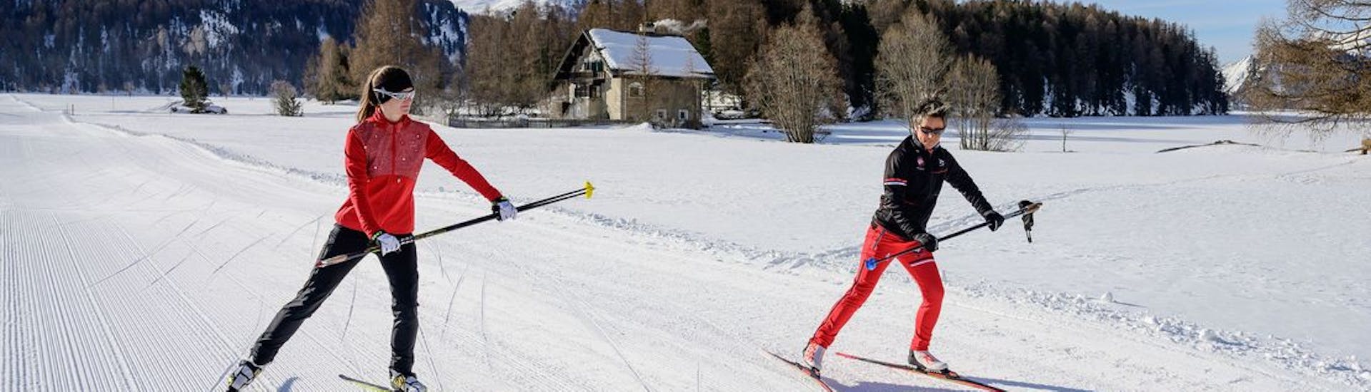 A cross-country skier is learning the classic technique during private cross-country skiing lessons with Swiss Ski School St. Moritz the Red Legends.