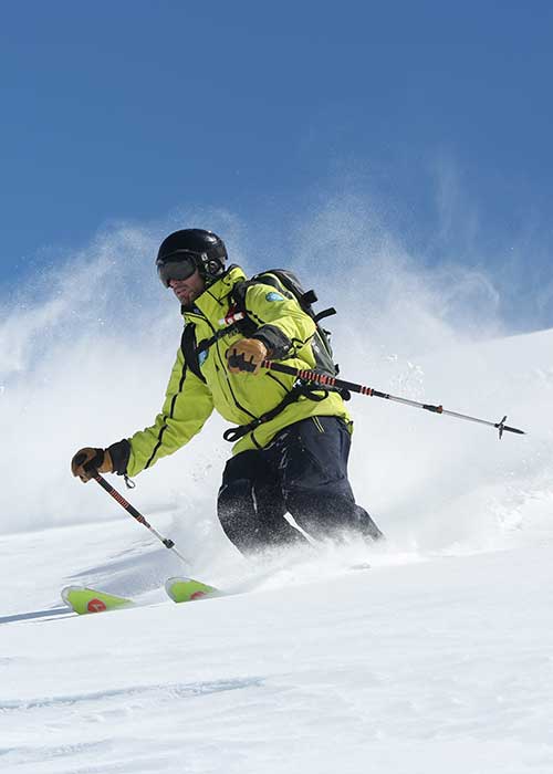 A skier ventures off the beaten track during a private ski lesson for adults with Prosneige Alpe d'Huez. 