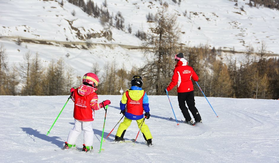 Ski instructors show the technique in Pragelato during one of the kids ski lessons for beginners. 