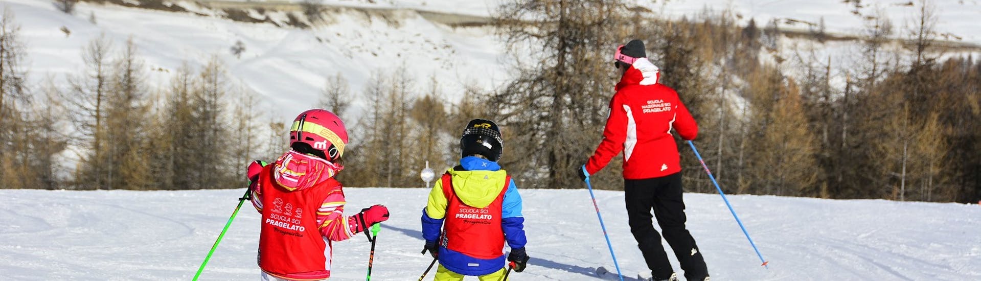 Ski instructors show the technique in Pragelato during one of the kids ski lessons for beginners. 