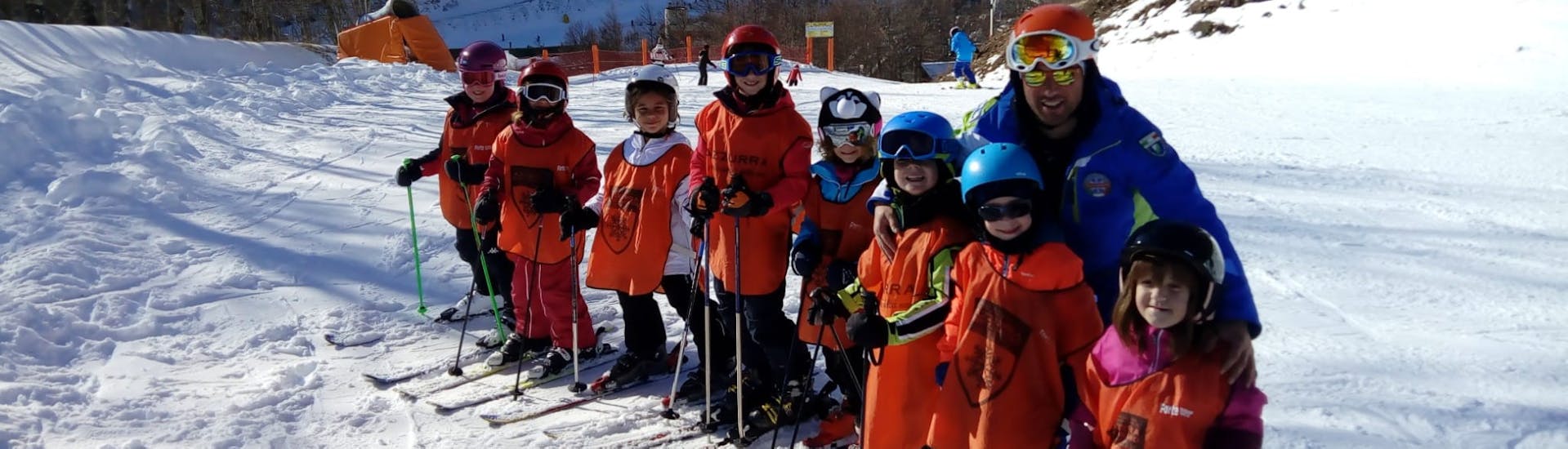 Kids and ski instructor enjoying their time during one of the kids ski lessons for all levels in Roccaraso.