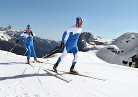 A woman is exploring cross country skiing during lessons for beginners with Scuola di Sci Andalo Dolomiti die Brenta.