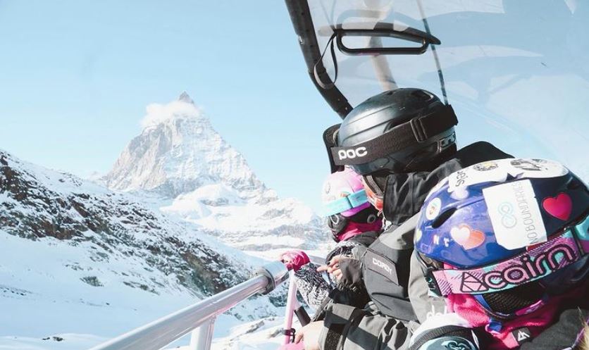 Two children take the chairlift up the mountain during their kids ski lessons for kids ages 13-17 for all levels with the PDS Snowsports ski school.