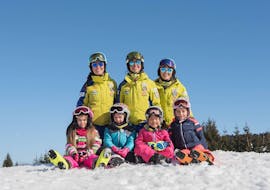 Kids and ski instructors are smiling during one of the kids ski lessons for all levels. 