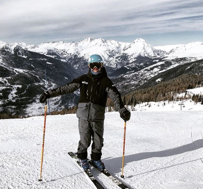 A skier stands on the slopes in Champéry during his teens ski lessons for all levels with the PDS Snowsports ski school.