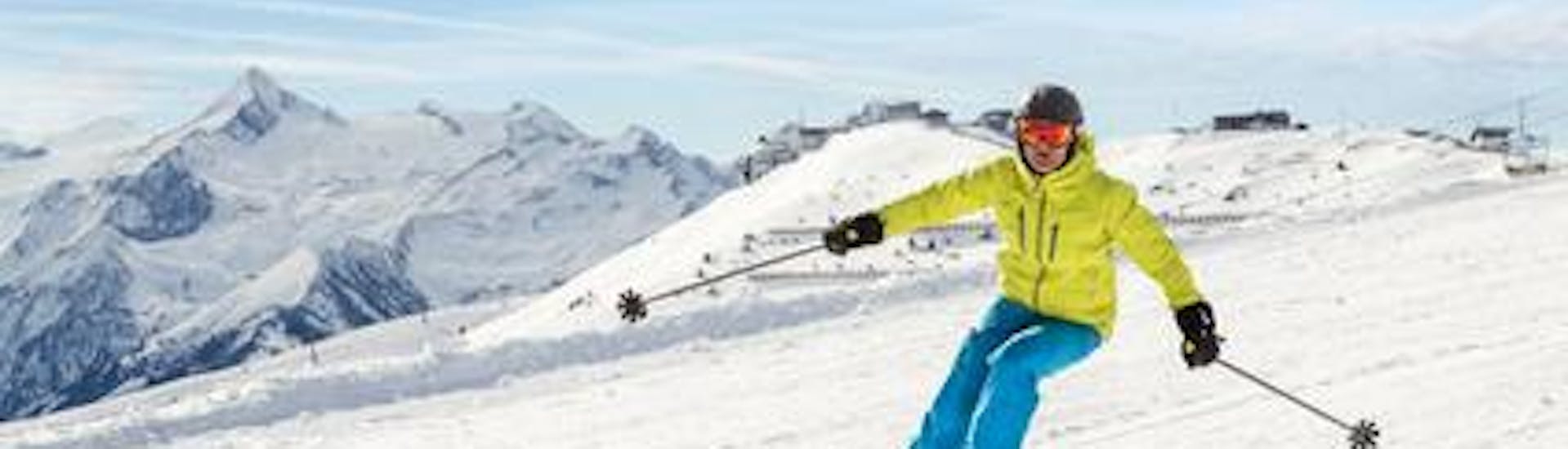 Een skiër raast de piste af tijdens zijn skilessen voor volwassenen voor beginners bij de Alpine Skischool Edelweiss.