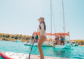 Paddleboarding during the Private Half Day Sailing Yacht Trip around Zadar The Day Sail