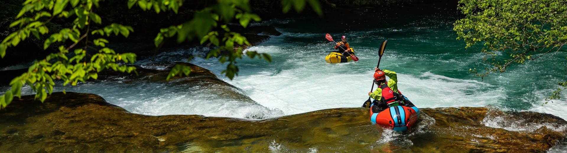 Rafting down a rapid during the packrafting on the Mreznica River hosted by Raftrek Adventure Travel Croatia.