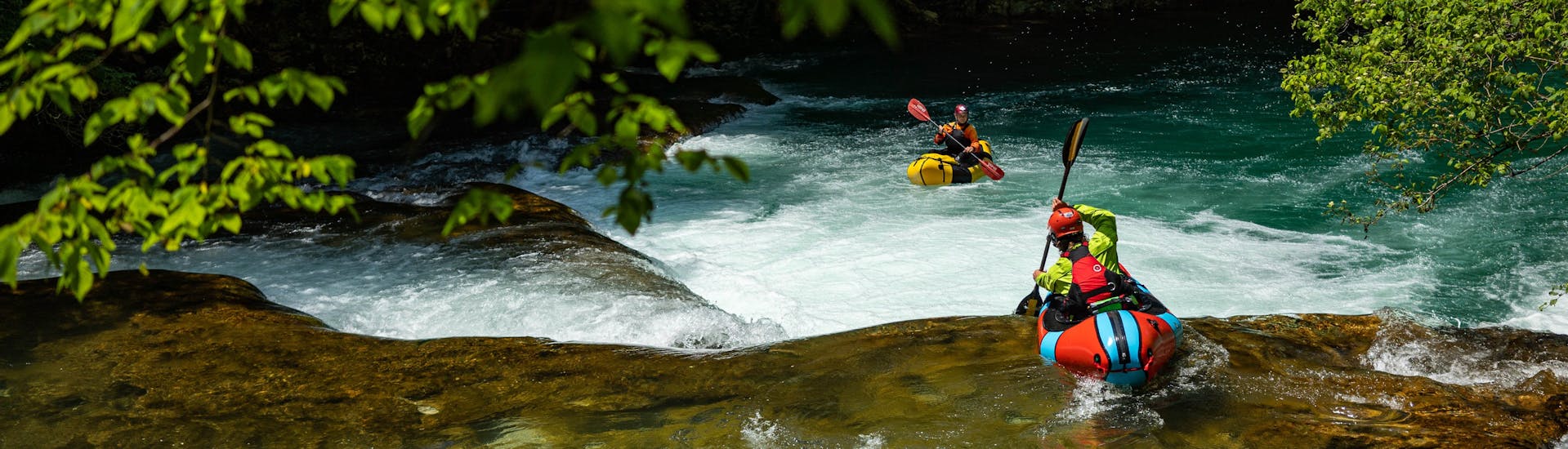 Rafting down a rapid during the packrafting on the Mreznica River hosted by Raftrek Adventure Travel Croatia.