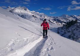 Snowshoeing Tours from Ski School Warth A hiker during his snowshoeing tour for all levels with ski school Warth in Wart-Schröcken.