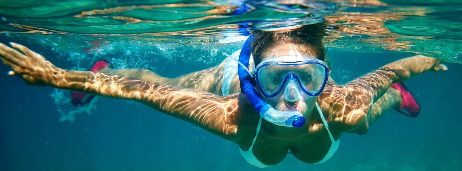 Woman snorkeling during a Private Boat Trip around Mallorca's Coast with Snorkeling with Royal Charters Mallorca.