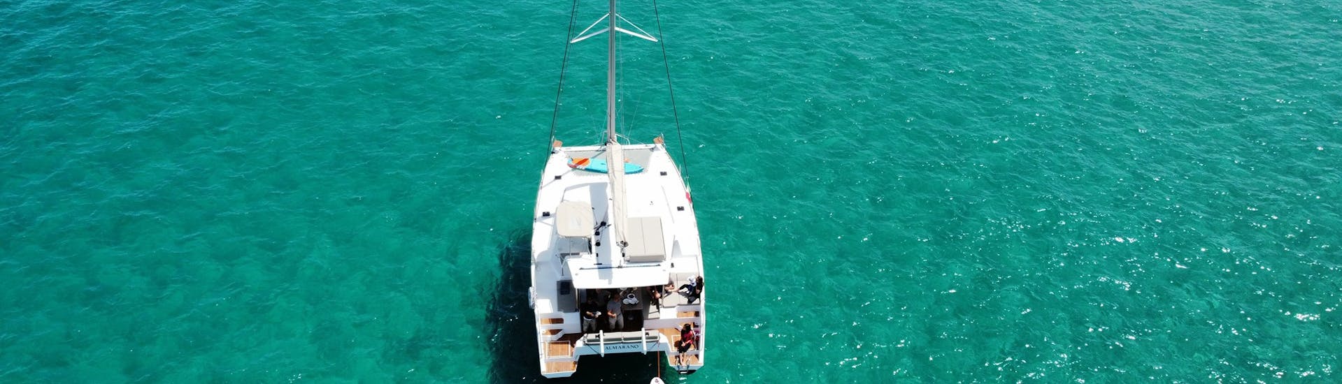 View of the Catamaran with crystal clear waters during the Private Catamaran Trip to the Polignano a Mare Caves with Pugliamare.