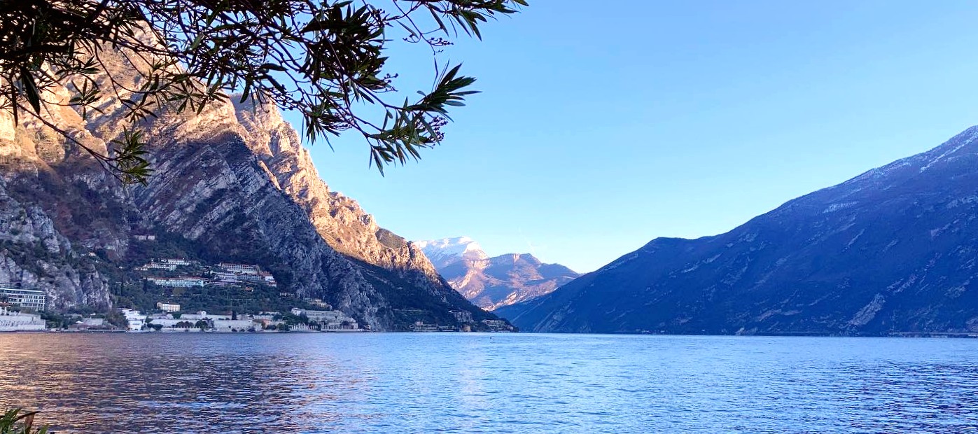 View of the mountains on the Garda Lake with the morning light during the Full Day Boat Tour of Garda Lake with Garda Escursioni.