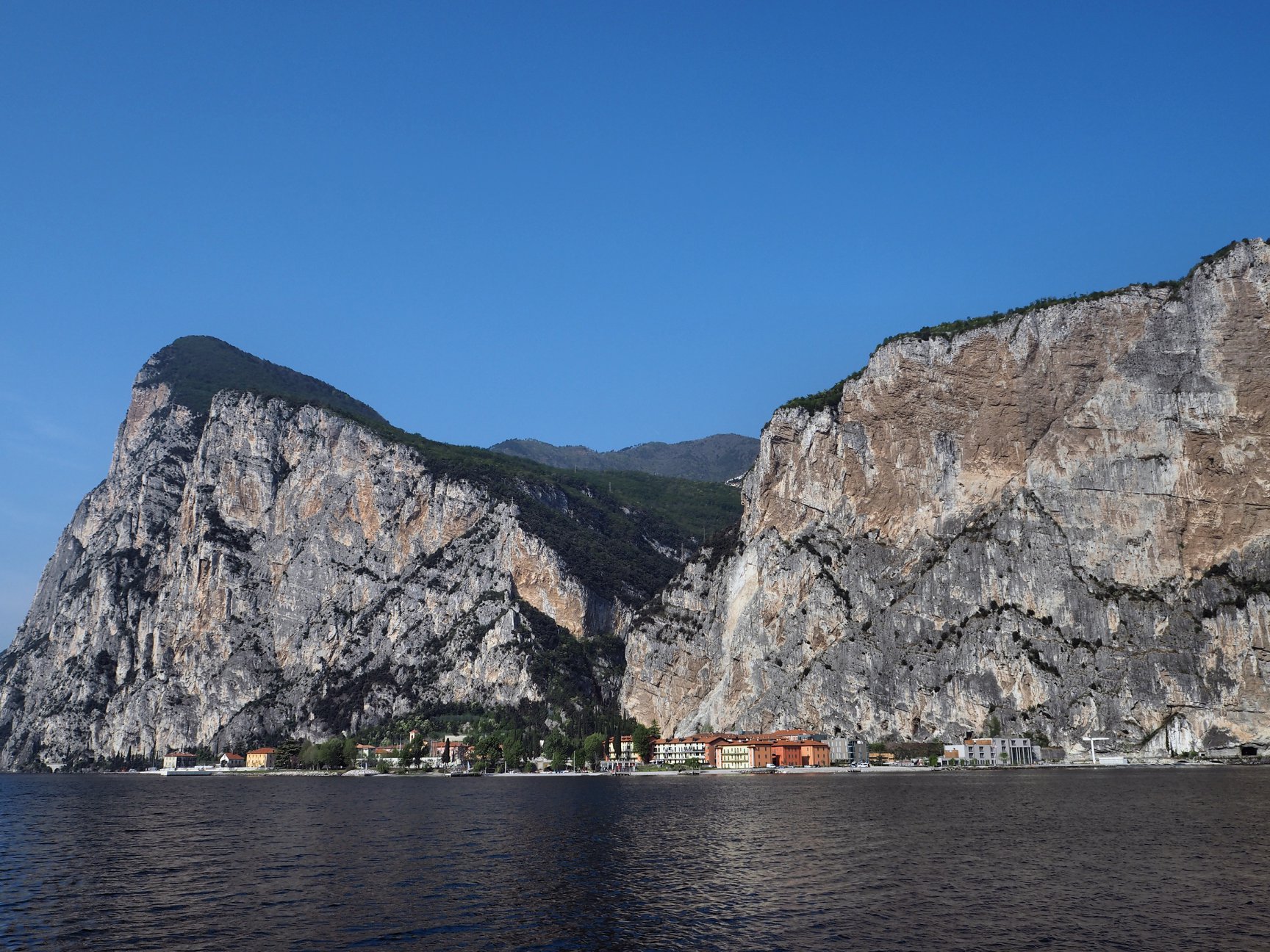 View of the mountains on the Garda Lake with the morning light during the Full Day Boat Tour of Garda Lake with Garda Escursioni.