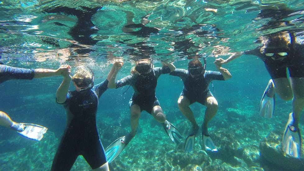 Participants in the water having fun during the snorkeling fun day at Lia Beach in Mykonos with GoDive Mykonos.