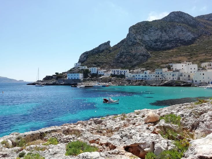 View of the town of Levanzo with some extremely clear waters during the Yacht Trip to Favignana and Levanzo from Trapani with Egadi Escursioni.