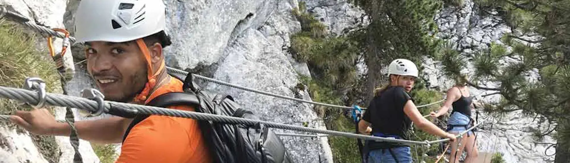 A man and two women on a bridge during the Via Ferrata of la Sambuy near Annecy with Terreo Canyoning.