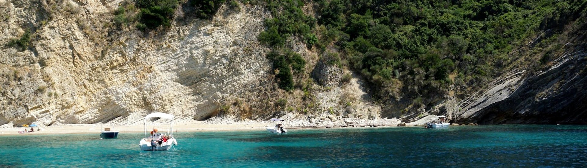An almost empty bay during the Private Boat Tour from St. Petros Beach in Palaiokastritsa with Ski Club 105 Corfu.
