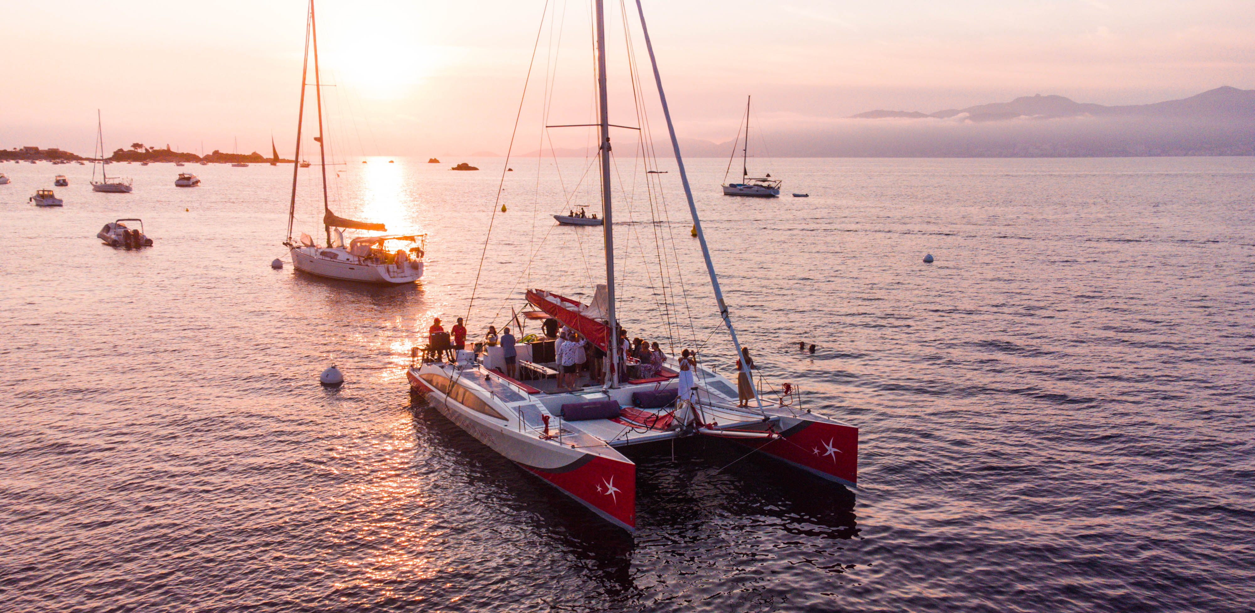 People participate to the Private Catamaran Trip at Sunset in the Bay of Ajaccio with Voglia di Mare.