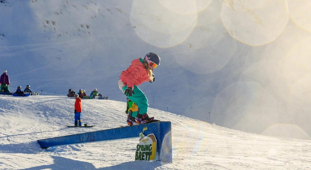 Kids Snowboarding Lessons (from 7 y.) for All Levels from Ski School ESKIMOS Saas-Fee.
