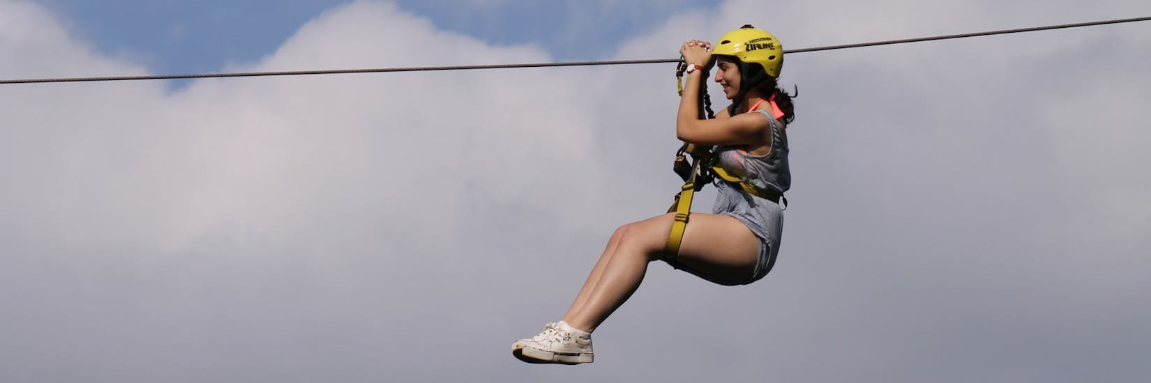 A woman while Ziplining in Radovljica next to Bled with Tina Raft.