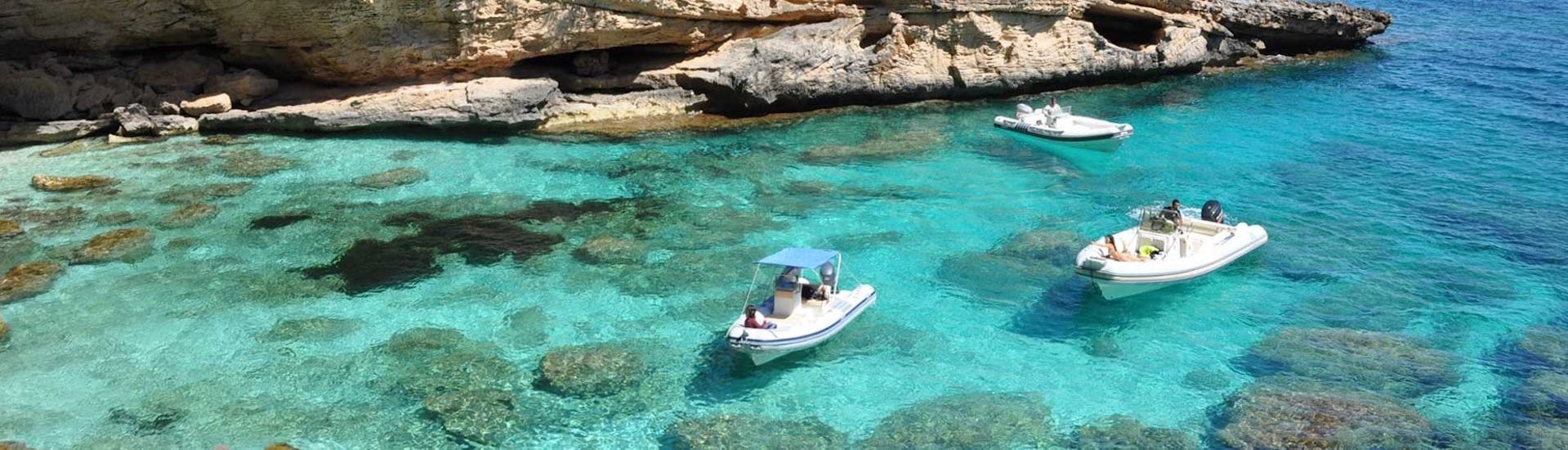 View of some rib boats in the clear Sardinian waters during the Boat Rental in Arbatax (up to 2 people) with Flamar Vacanze Arbatax.