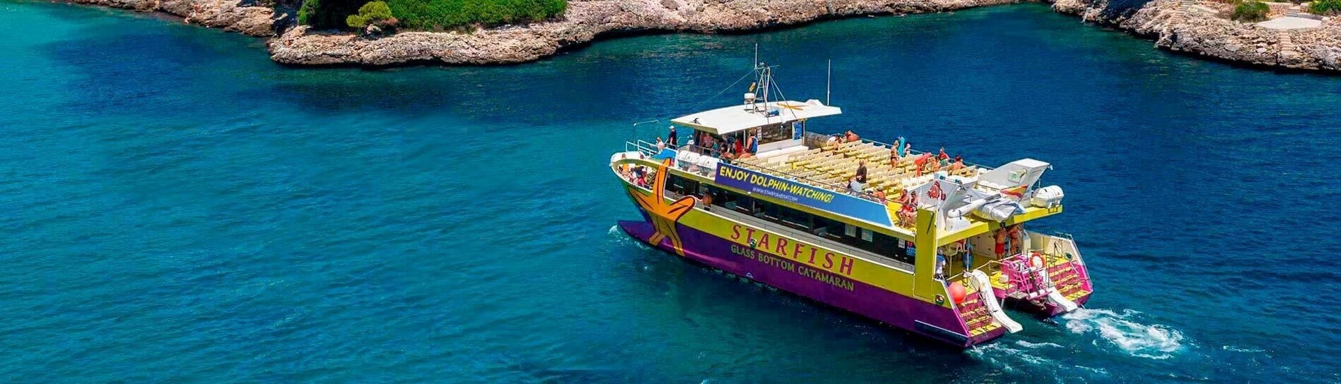 Our boat during a Glassbottom Catamaran Trip to Cala Figuera with Snorkeling with Starfish Glass Bottom Boats Mallorca.