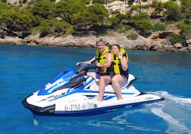 A couple riding a jet ski during a Jet Ski Safari in Cala Millor with SeaSports Mallorca.