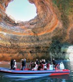 People on the boat marveling at the Benagil Cave during the Boat Trip from Albufeira to the Benagil Cave with Dolphin watching with Allboat Albufeira.