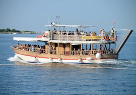 The traditional wooden boat of Victoria Tours Poreč on the sea during the boat tour from Poreč to Rovinj, Vrsar and the Lim Fjord.