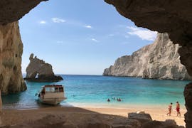 View from a cave to the sea and the boat during the boat trip to Navagio Beach from Porto Vromi.