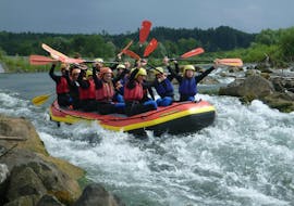 A group of friends cheering during the Rafting on the Iller River in Allgäu - All in one Raft with Spirits of Nature Allgäu.