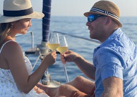 Couple enjoying champagne during their Private Sailing Trip at Sunset from Rovinj with Sailing Pulpa Rovinj.