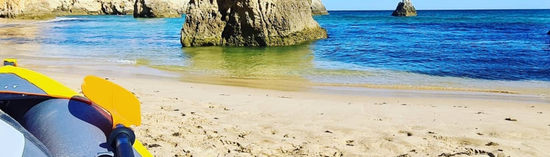 Kayak is located on a hidden beach at the kayak rental at Benagil beach with Algarve Discovery.