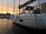 The sunset and a boat from Palmayachts Charters Portugal during the Private Sunset Boat Trip from Cascais.