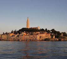 Picture of Rovinj during the sunset from the sea during the sunset boat trip hosted by Boat Excursions Tonka Rovinj.