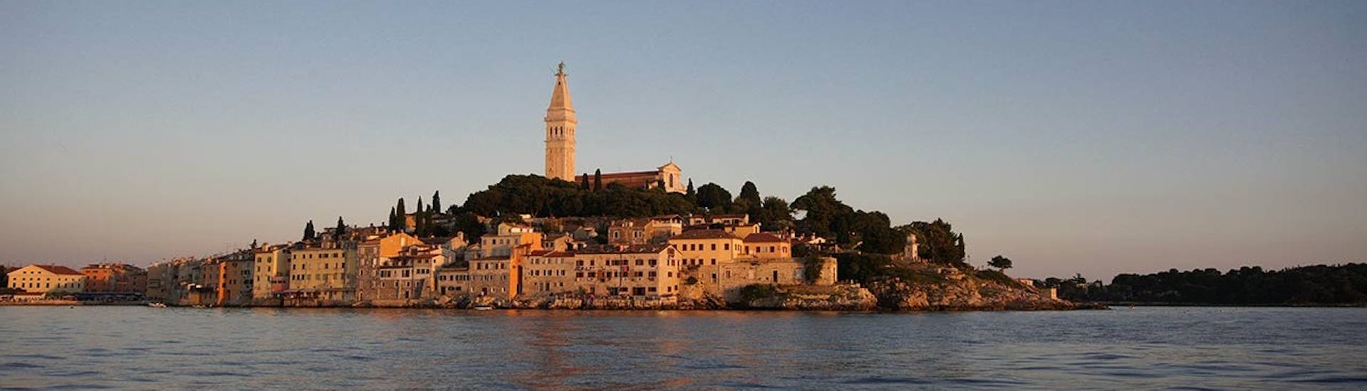 Picture of Rovinj during the sunset from the sea during the sunset boat trip hosted by Boat Excursions Tonka Rovinj.