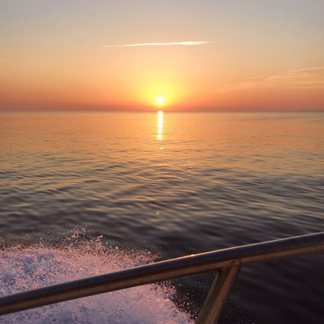 View of the sun during the Sunset Boat Trip Scandola & the Calanques of Piana with Albellu Croisières Sagone.
