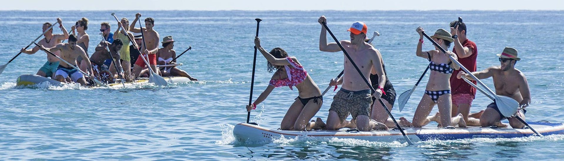 People enjoying during a SUP Lessons for Big Groups on Malagueta Beach with Malagawake.