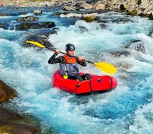 A person tackles some rapids during our packrafting on Lima River from Borgo a Mozzano with Garfagnana Rafting.