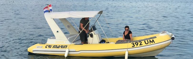 Two people on the boat from the Boat Rental with Licence in Umag (up to 8 people) with Action & Fun Umag.