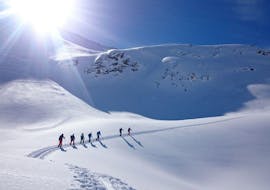 People are joining a private ski tour with a guide from ski school Stuben.