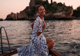 A girl posing for the picture during the Sunset Boat Trip from Taormina with Aperitif with Boat Experience Taormina.