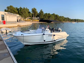 The motorboat at the harbour used for boat rental in Pula and Medulin with Zoom Boats Istria.