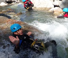Child in the water during the Discovery Canyoning in Eaux Rousses Canyon near Moûtiers with Terreo Canyoning Annecy.
