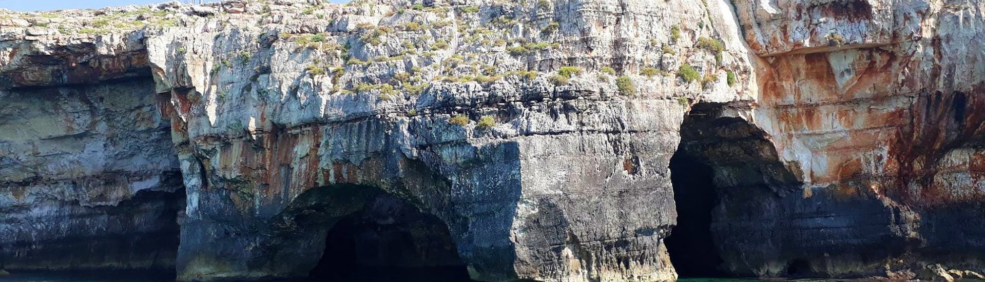 Photo of the beautiful Grotta delle Tre Porte taken during a private RIB boat trip from Tore Vado to the Leuca caves with an aperitif with Rosa dei Venti Escursioni.